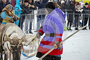 Local aborigines - Khanty, ride children on a reindeer sleigh of three deer, sleigh, winter, Ã¢â¬ÅSeeing off winterÃ¢â¬Â festival